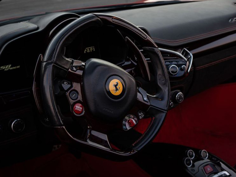Red Ferrari 458 Spider inside view drivers seat