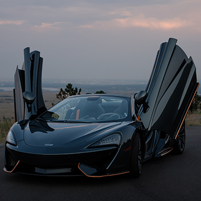 Black McLaren 570s Spider doors open